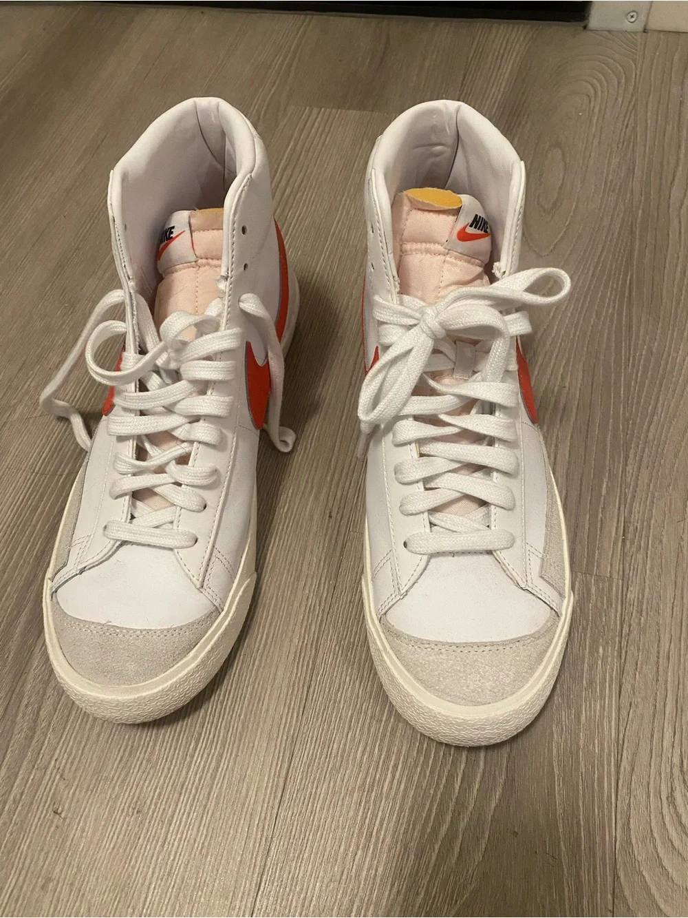 Nike White High-Top Sneakers with Red Swoosh Accent